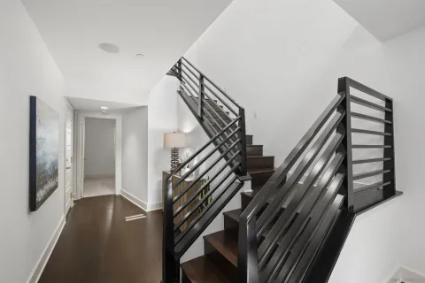 a white toilet sitting next to a bathroom sink