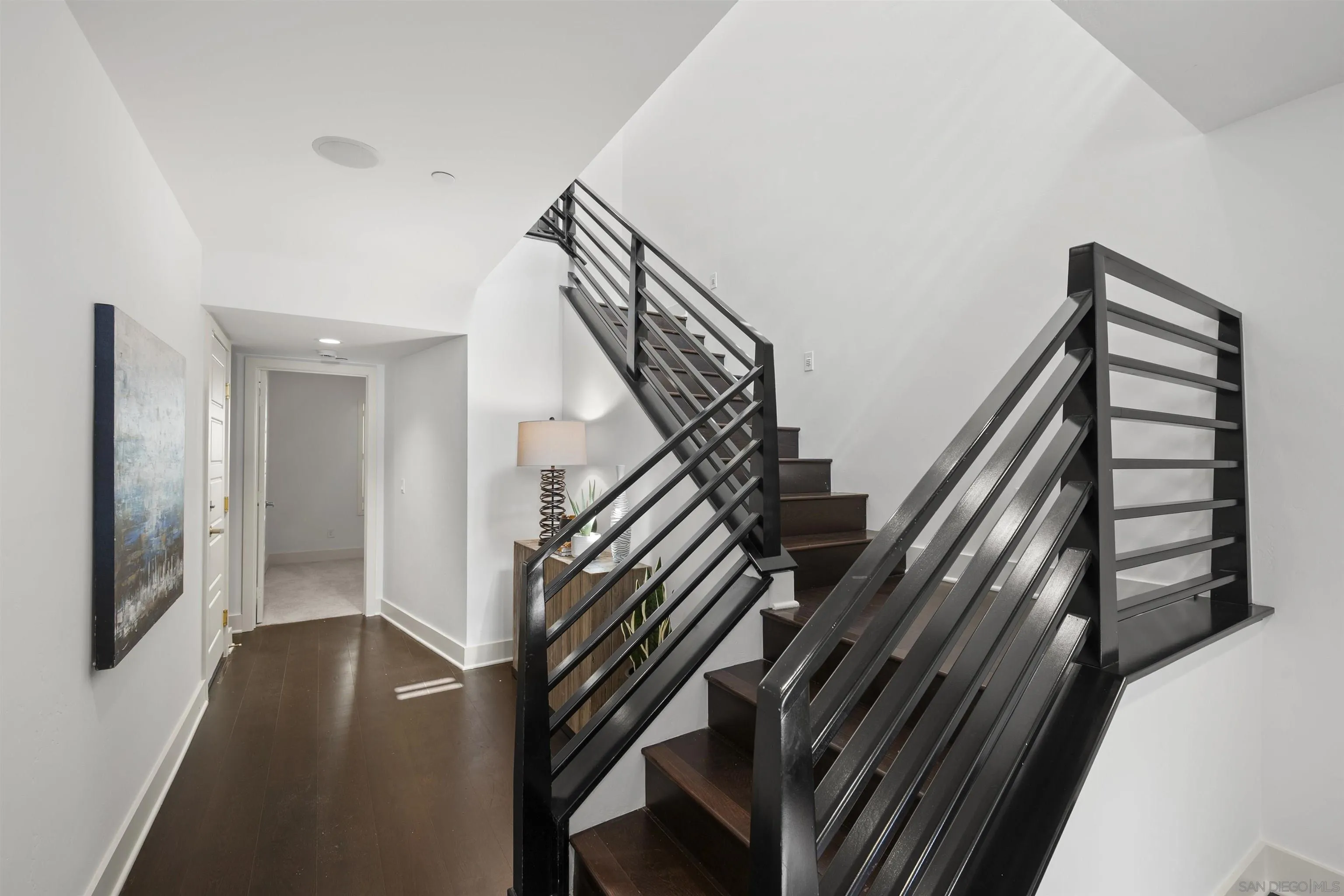 7853 Inception Way San Diego, CA 92108 - Photo 8 of 66 a view of entryway and hall with wooden floor
