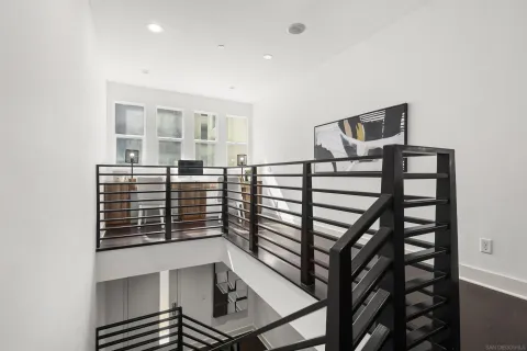 a view of a dining room with a table and chairs