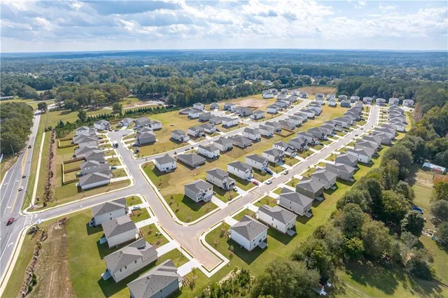 an aerial view of residential building with parking space