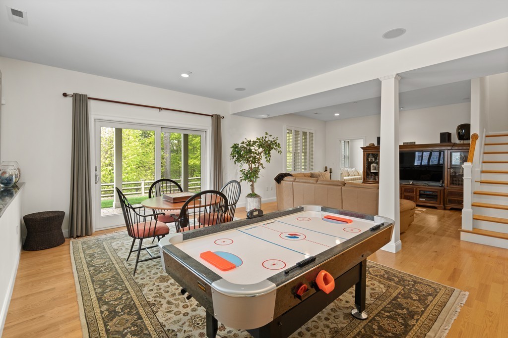 21 South Cottage Road, Unit 21 Belmont, MA 02478 - Photo 23 of 27 a living room with furniture and wooden floor