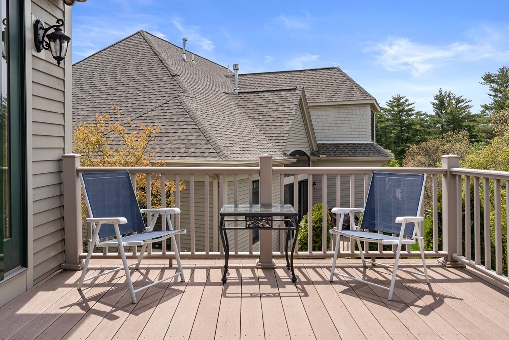 21 South Cottage Road, Unit 21 Belmont, MA 02478 - Photo 25 of 27 a view of house with deck outdoor seating and yard in back