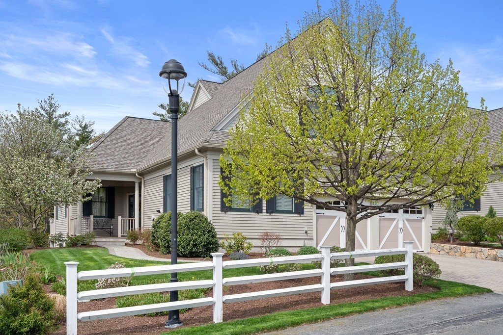 21 South Cottage Road, Unit 21 Belmont, MA 02478 - Photo 26 of 27 a front view of a house with a yard