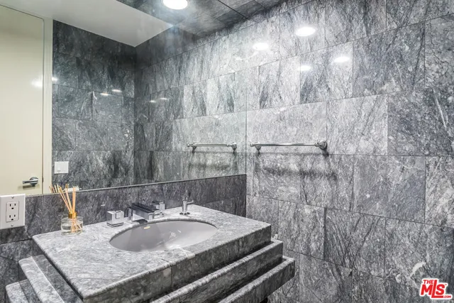 a kitchen with a table chairs and refrigerator