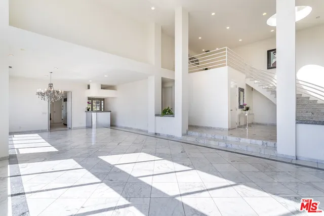 an outdoor space with seating area and trees