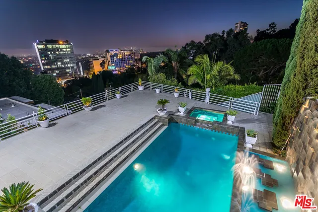 a view of a potted plants in backyard of a house