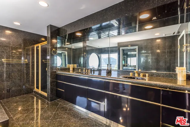 a view of balcony with two chairs and a table