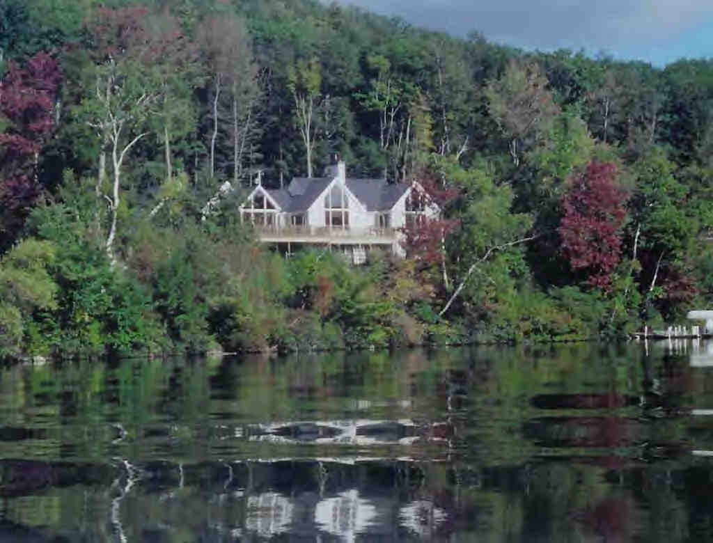 56 Elephant Rock Road Monterey, MA 01245 - Photo 6 of 9 a swimming pool with trees in the background