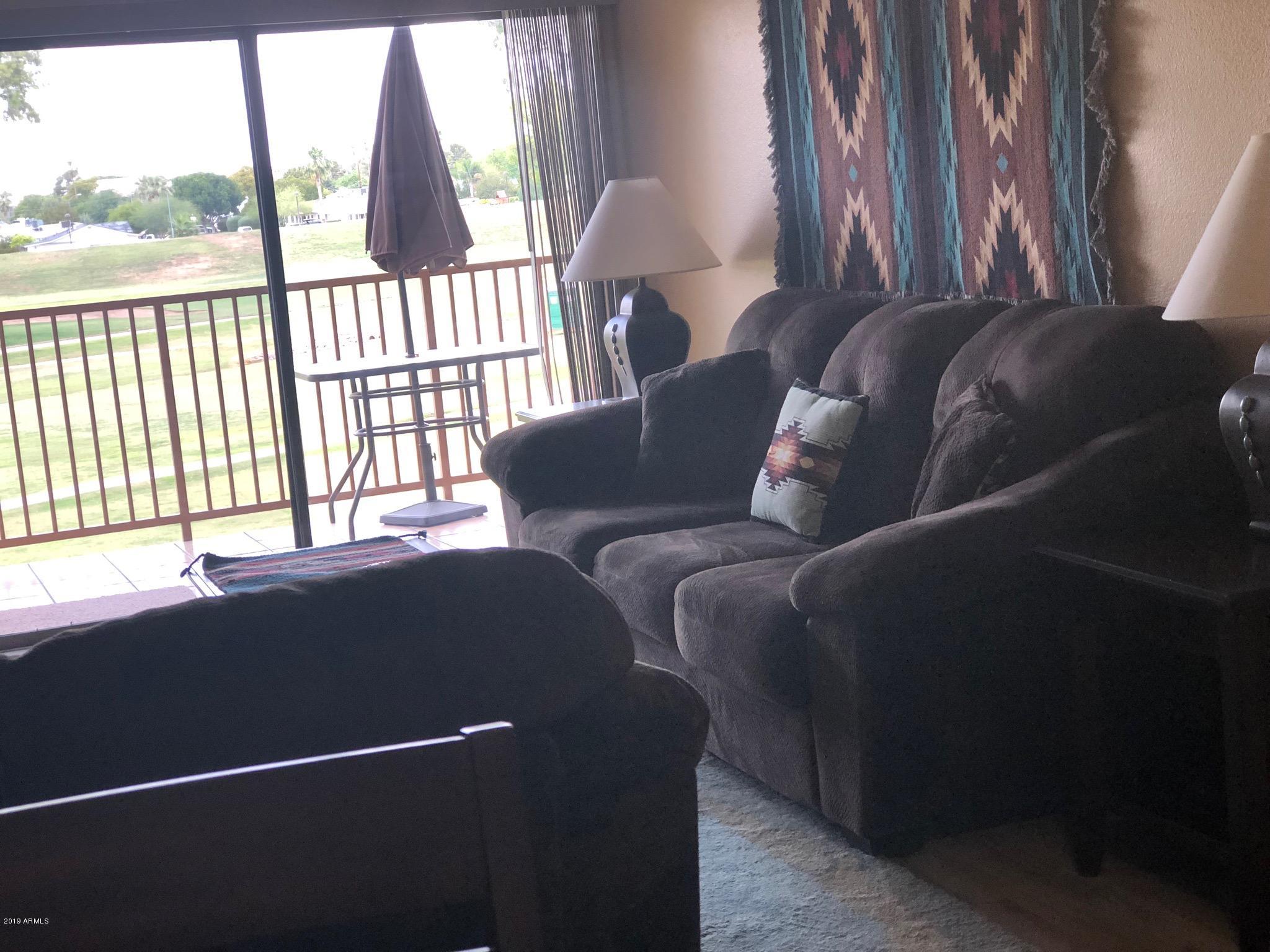 7910 East Thomas Road, Unit 226 Scottsdale, AZ 85251 - Photo 13 of 18 a living room with furniture and a window