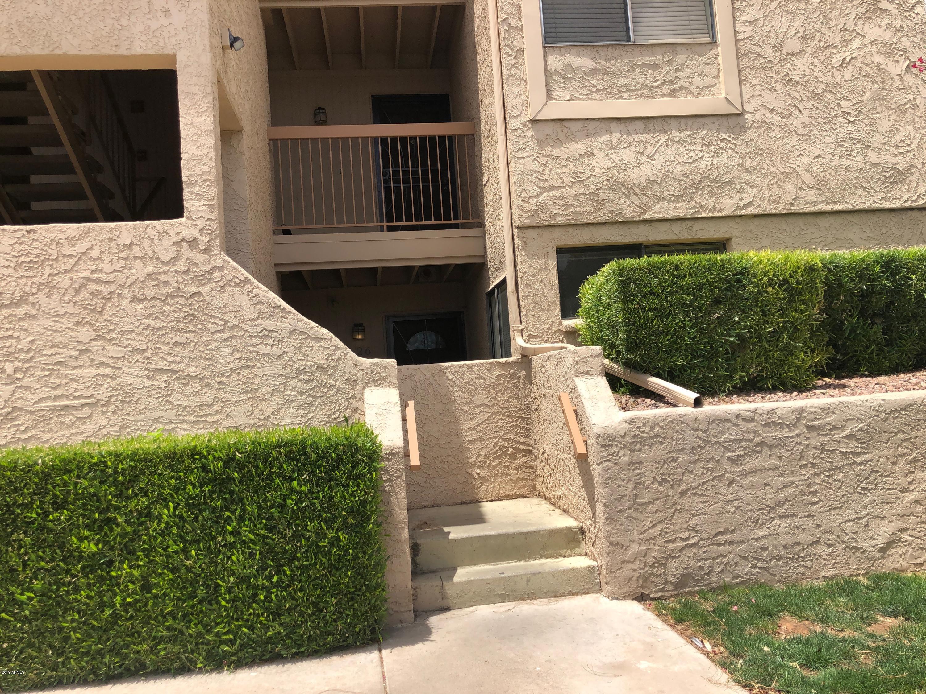 7910 East Thomas Road, Unit 226 Scottsdale, AZ 85251 - Photo 2 of 18 a view of entrance gate of house and yard