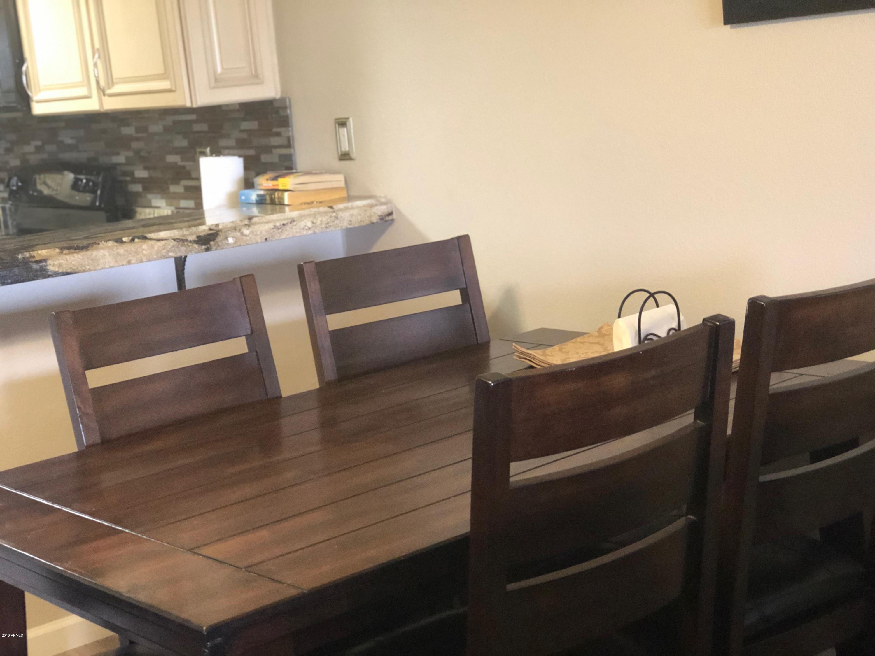 7910 East Thomas Road, Unit 226 Scottsdale, AZ 85251 - Photo 4 of 18 a kitchen with a sink cabinets and window