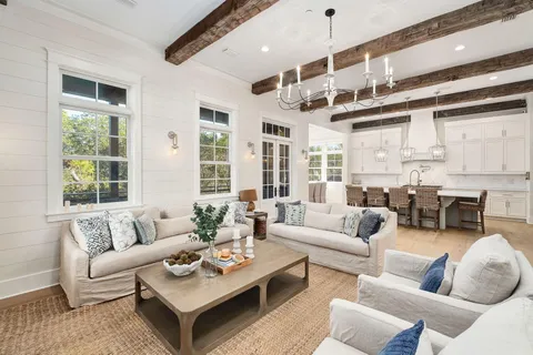 a living room with furniture and windows