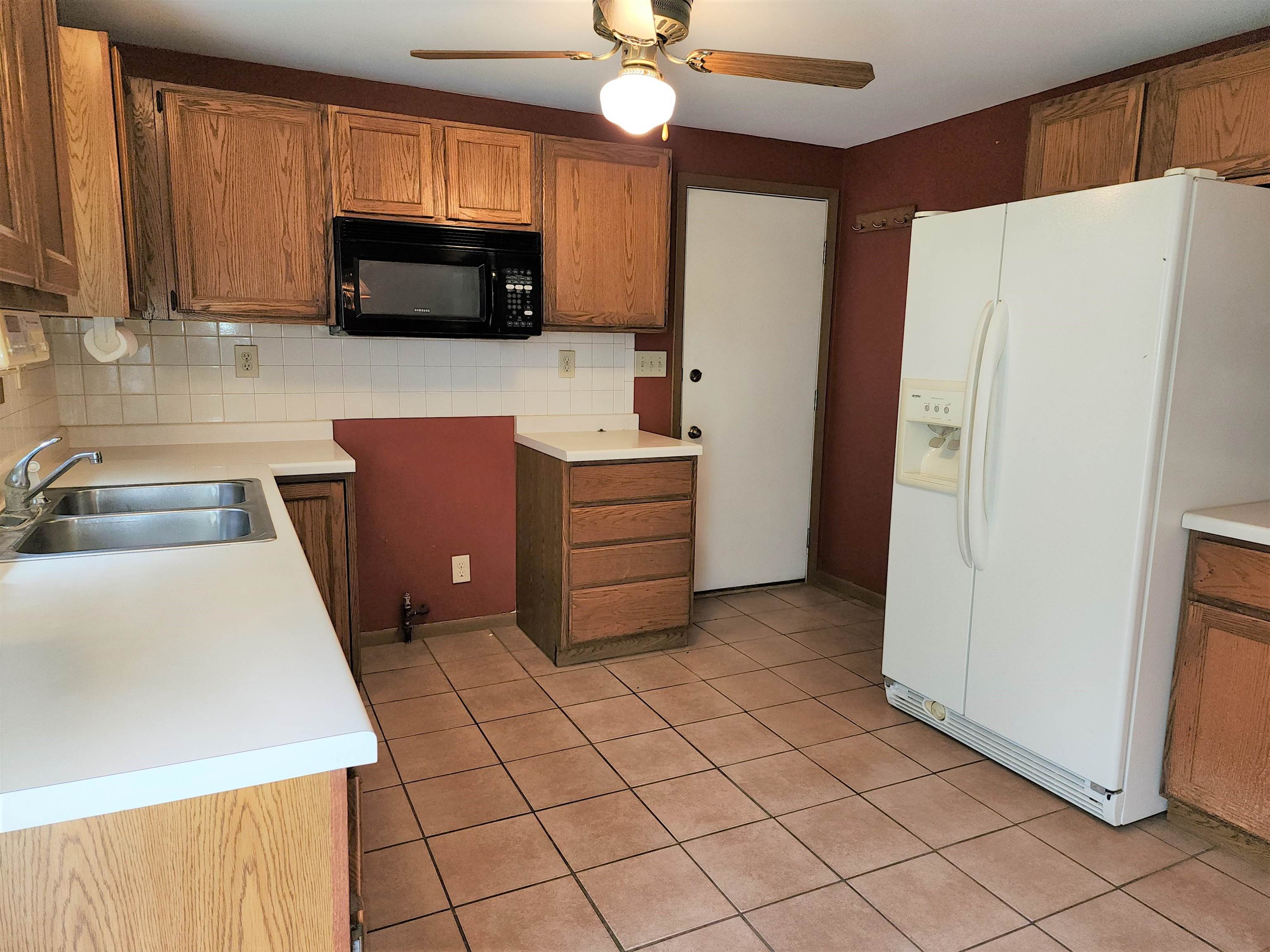 3443 Eddie Road Winnebago, IL 61088 - Photo 12 of 29 a kitchen with stainless steel appliances a refrigerator sink and microwave