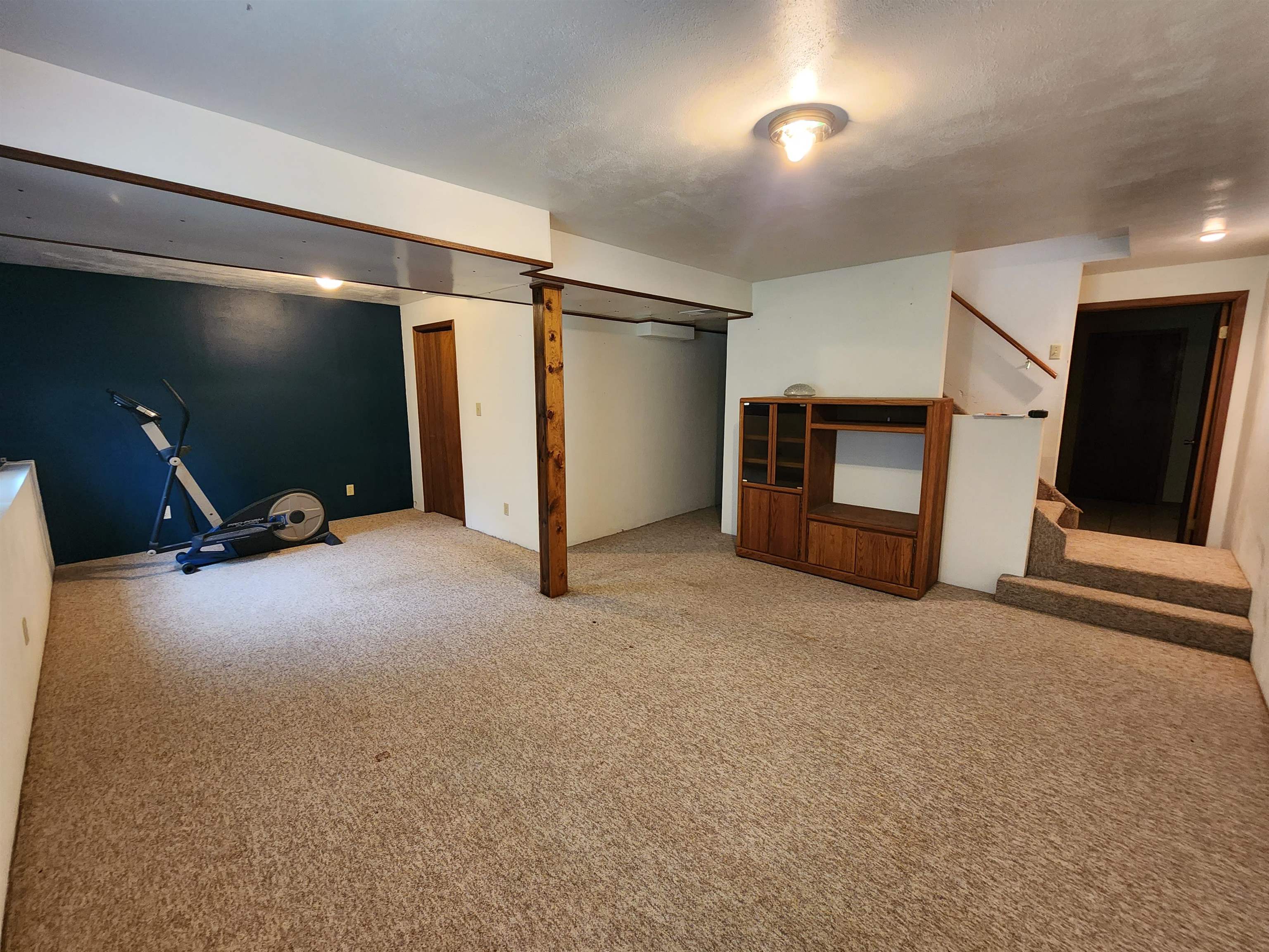 3443 Eddie Road Winnebago, IL 61088 - Photo 20 of 29 a view of an empty room with furniture and a flat screen tv