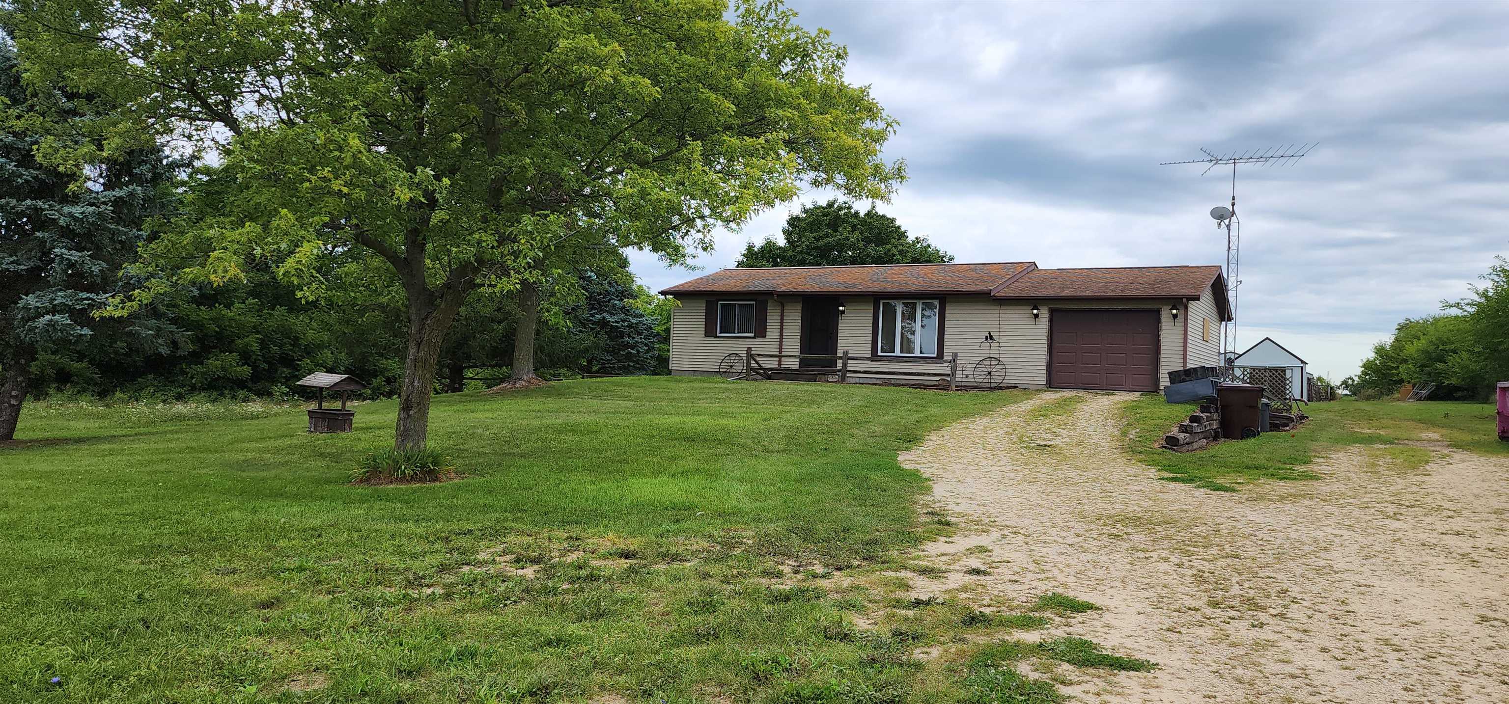 3443 Eddie Road Winnebago, IL 61088 - Photo 2 of 29 a front view of a house with a yard