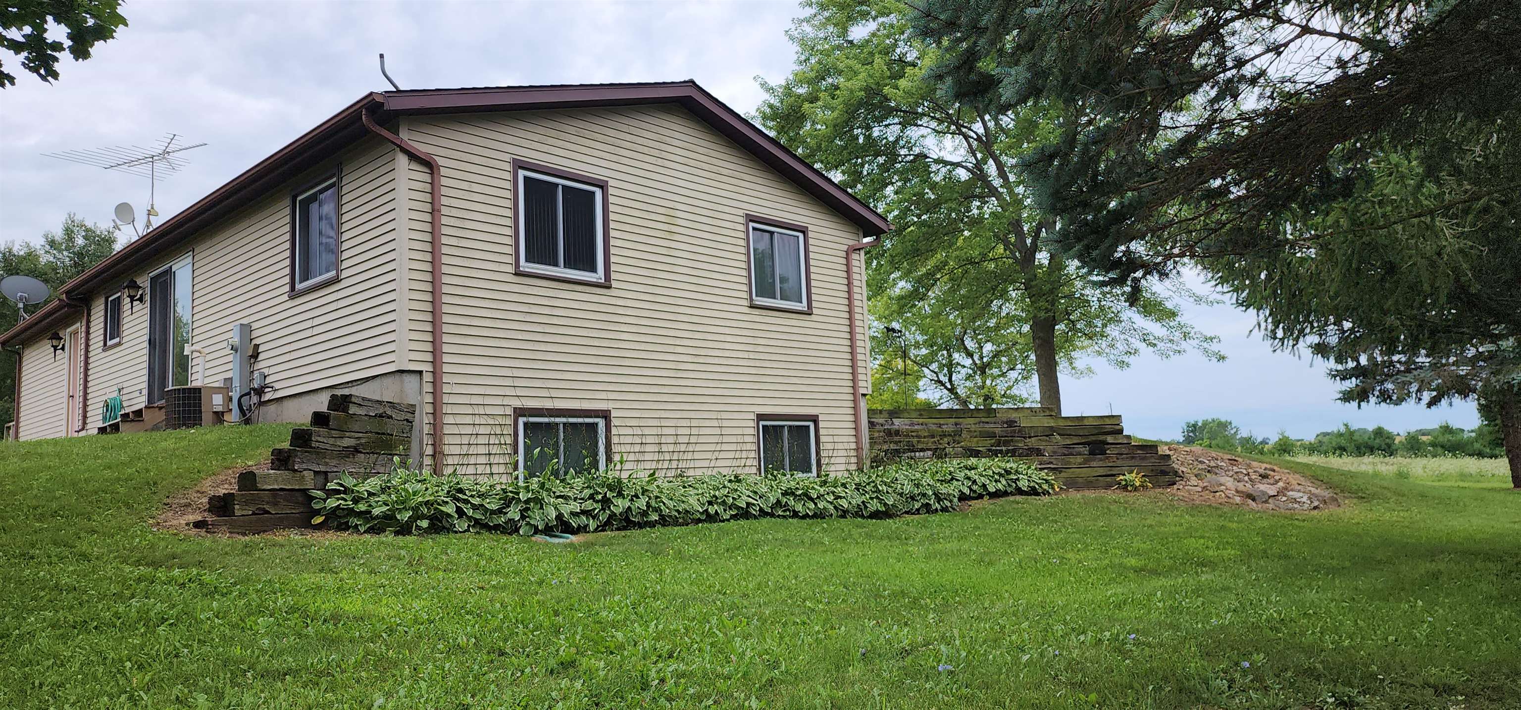 3443 Eddie Road Winnebago, IL 61088 - Photo 3 of 29 a front view of house with a garden