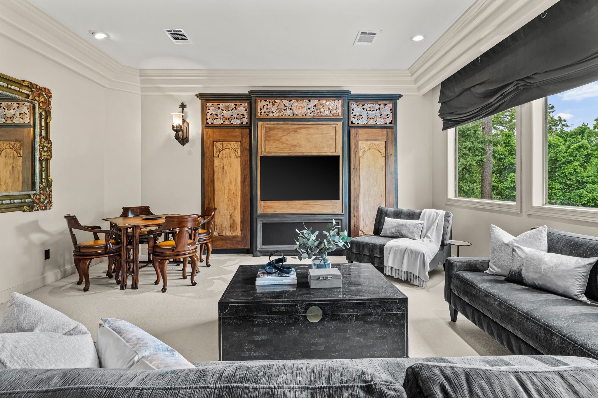 6 Mott Lane Houston, TX 77024 - Photo 36 of 50 Comfortable and refined media or game room featuring custom built-ins with integrated entertainment center. Generous seating and a cozy layout make this the perfect space for relaxing, entertaining or movie night.