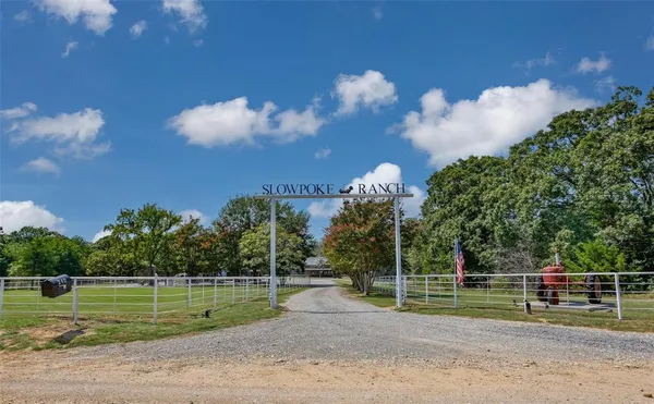 a view of a house with a big yard