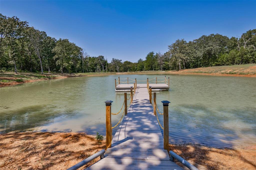 240 Magnolia Lane Bennington, OK 74723 - Photo 21 of 39 a view of a lake with houses
