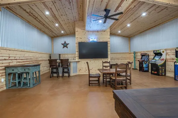 a view of a dining room with furniture and a chandelier