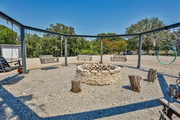 a view of a big room with table and chairs