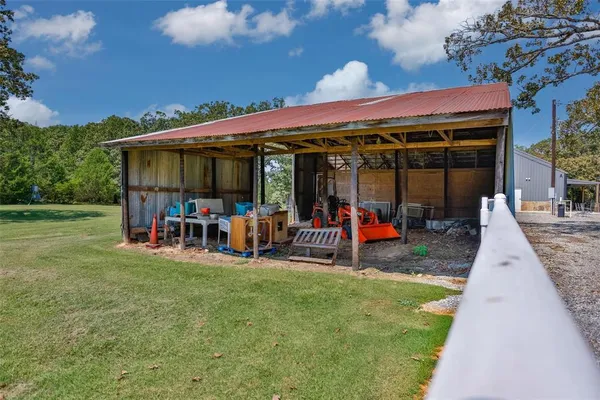 an aerial view of a house with yard swimming pool and outdoor seating
