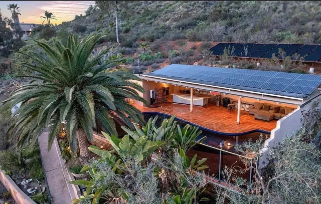 a balcony with table and chairs