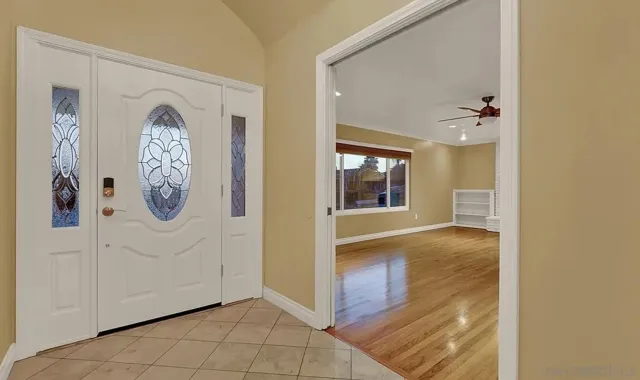 a view of livingroom with hallway and wooden floor
