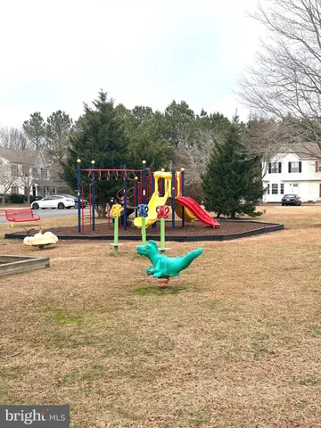 a childrens park with lots of swings and slides