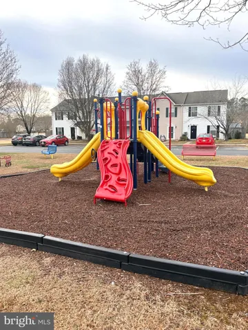 a view of a swimming pool with an outdoor space and seating area