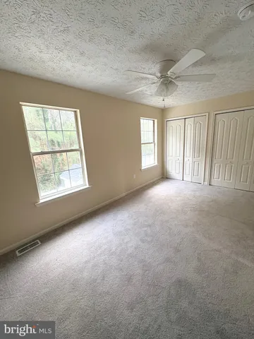 an empty room with windows