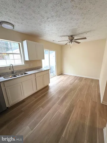 a view of a kitchen with a sink