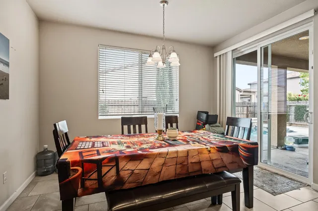 a bedroom with a bed and a table