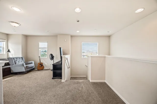 a view of a livingroom with furniture and windows