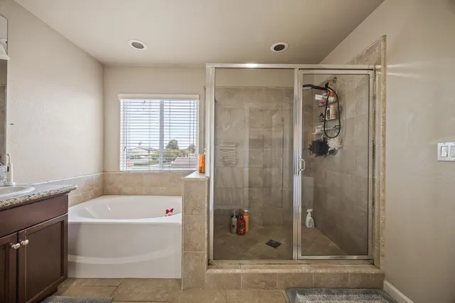 a bathroom with a shower and a bathtub