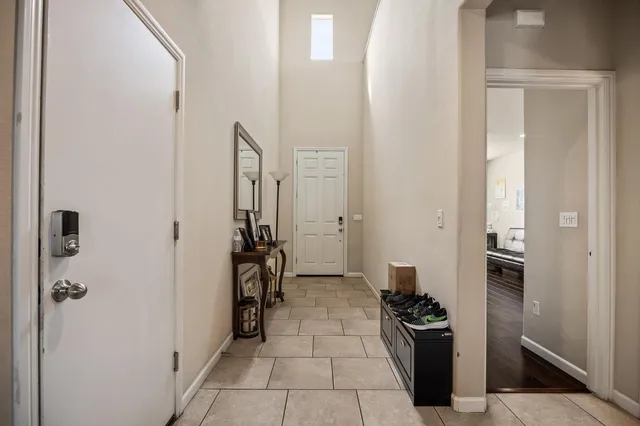 a kitchen with a refrigerator and a stove