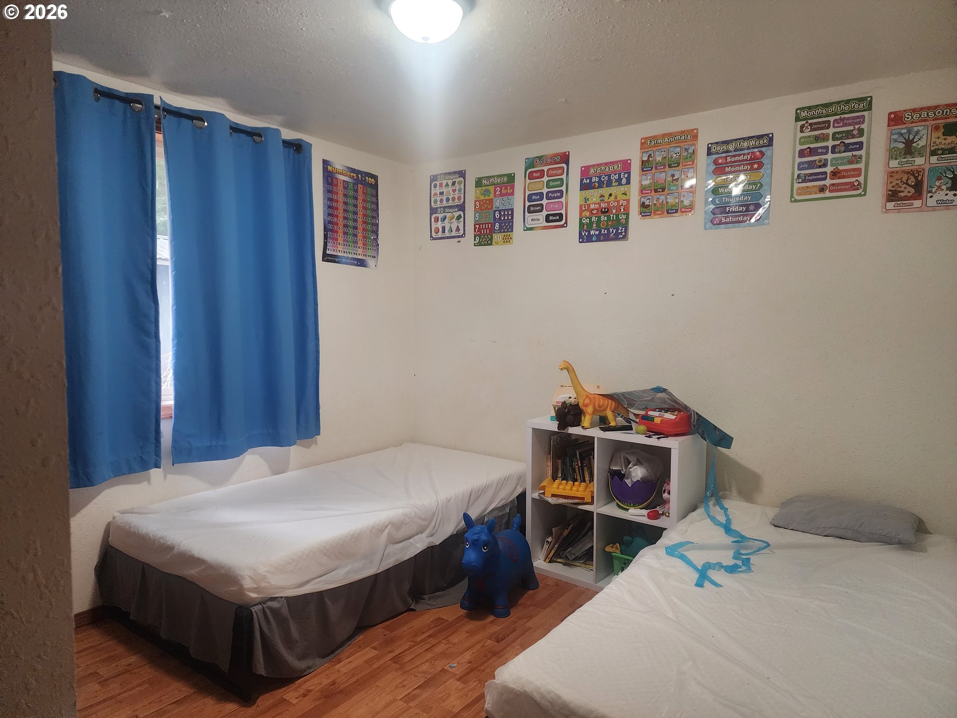 3117 South Tenmile Lakeside, OR 97449 - Photo 11 of 33 a bedroom with a bed and a window