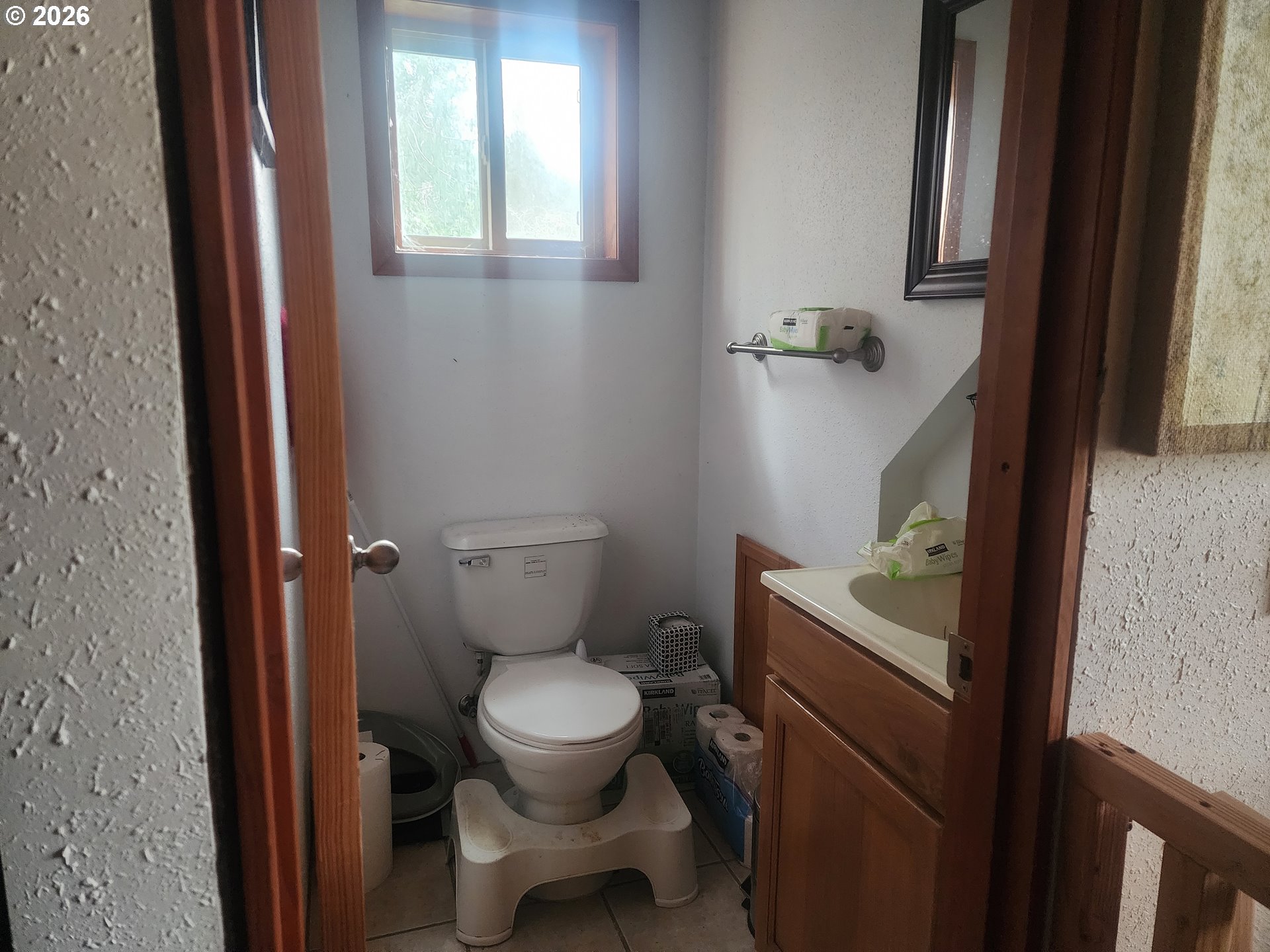 3117 South Tenmile Lakeside, OR 97449 - Photo 16 of 33 a bathroom with a toilet and a sink