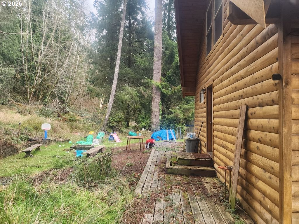 3117 South Tenmile Lakeside, OR 97449 - Photo 2 of 33 a view of yard with outdoor seating
