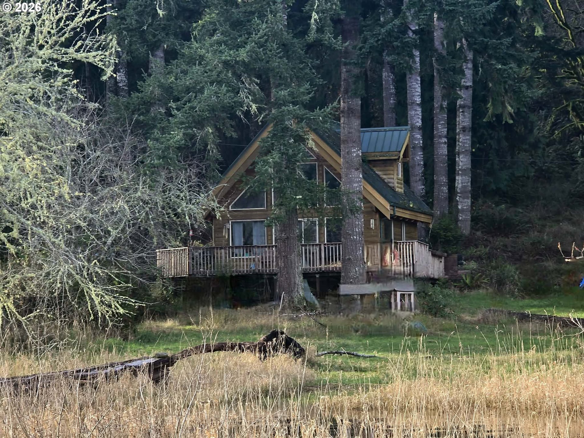 3117 South Tenmile Lakeside, OR 97449 - Photo 32 of 33 a front view of a house with a yard