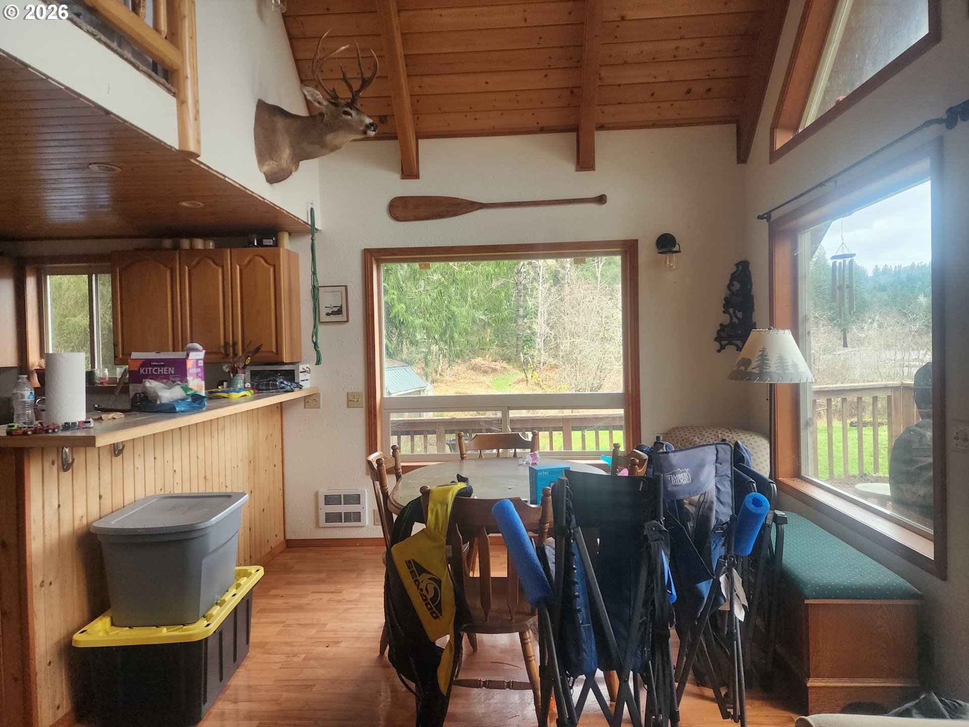 3117 South Tenmile Lakeside, OR 97449 - Photo 8 of 33 a view of a dining room with furniture window and outside view