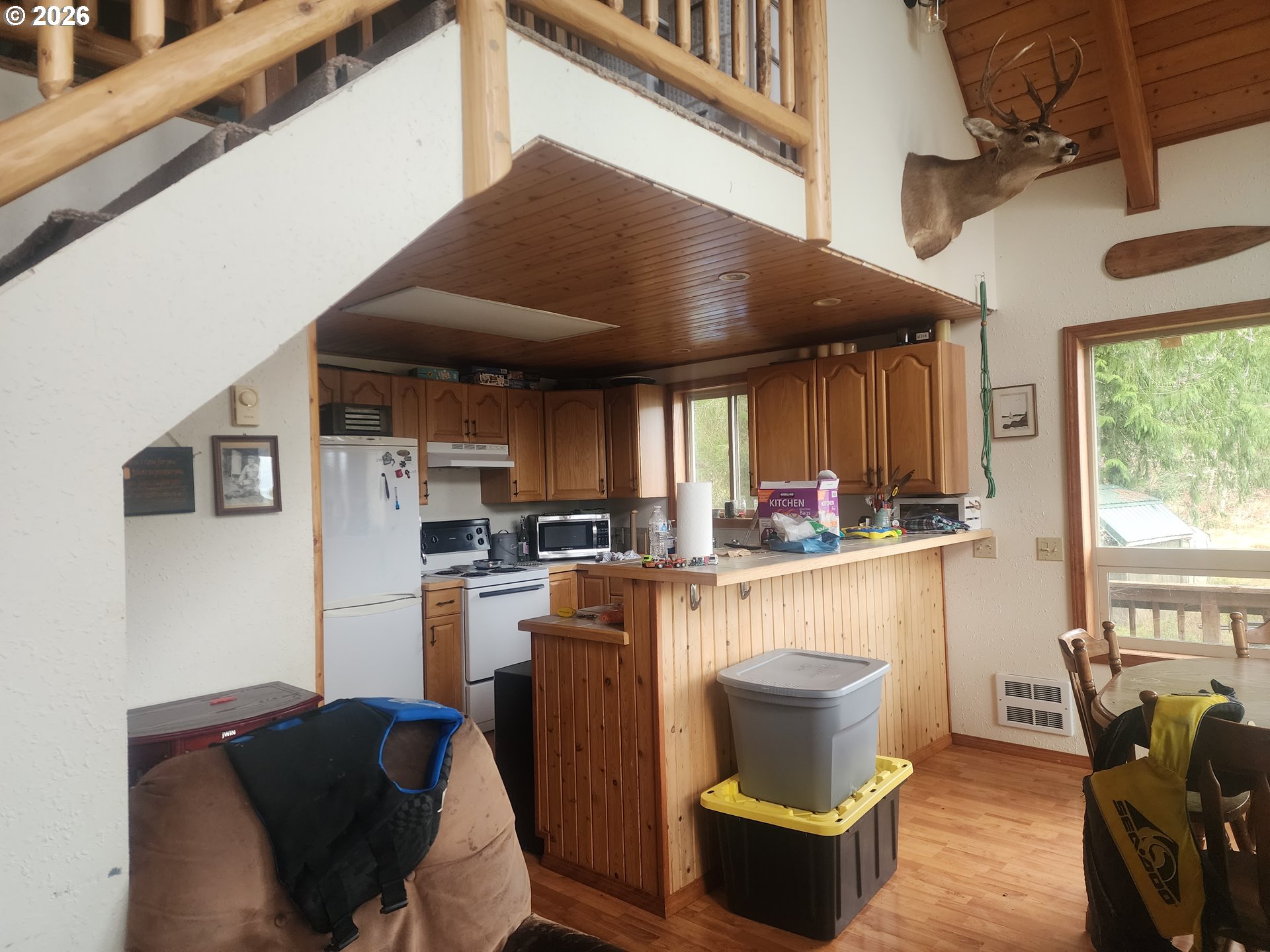 3117 South Tenmile Lakeside, OR 97449 - Photo 9 of 33 a kitchen with a stove and a refrigerator