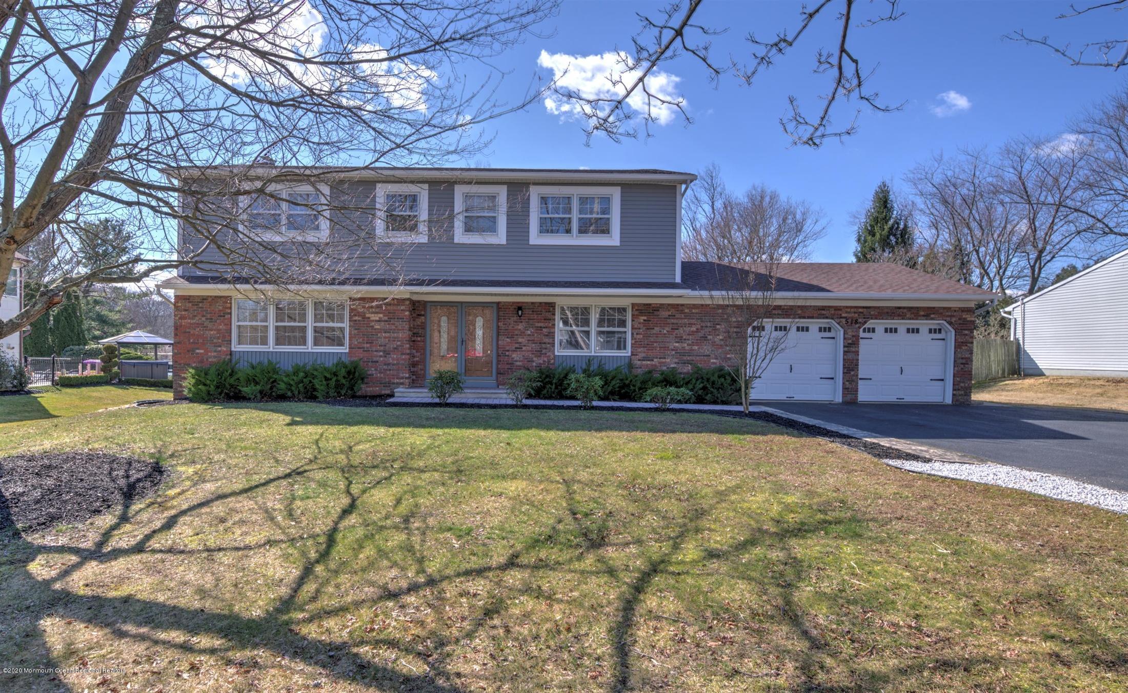 518 East Freehold Road Freehold, NJ 07728 - Photo 1 of 35 a view of a house with a swimming pool