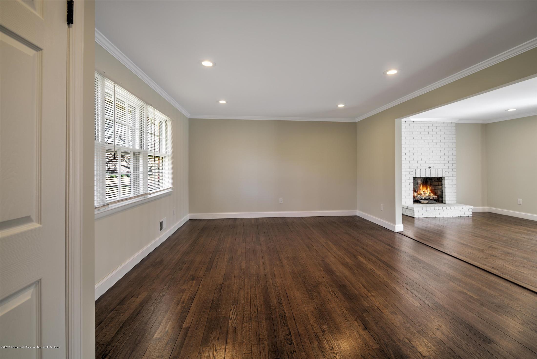 518 East Freehold Road Freehold, NJ 07728 - Photo 12 of 35 a view of empty room with wooden floor and window