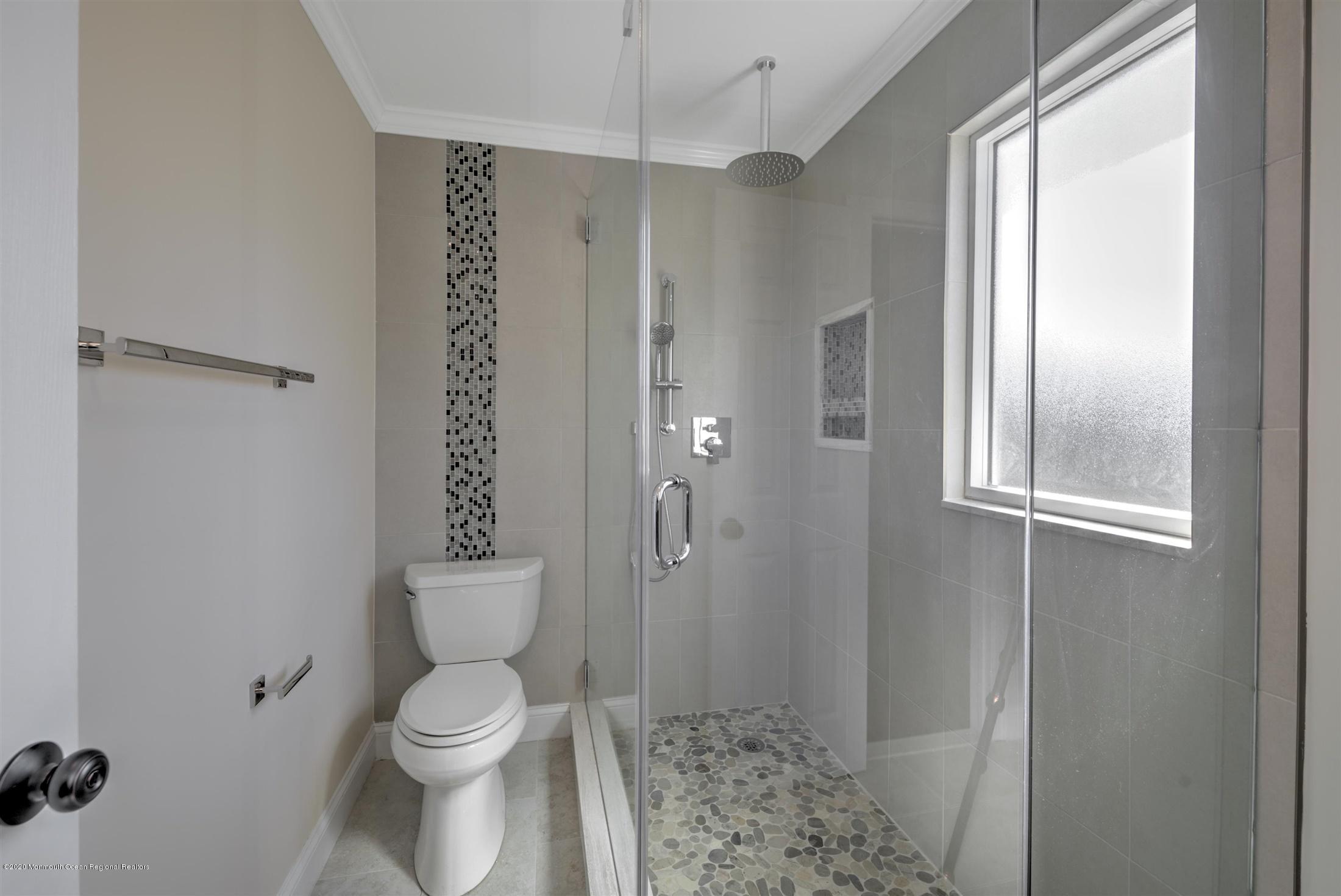 518 East Freehold Road Freehold, NJ 07728 - Photo 21 of 35 a bathroom with a toilet a sink and shower