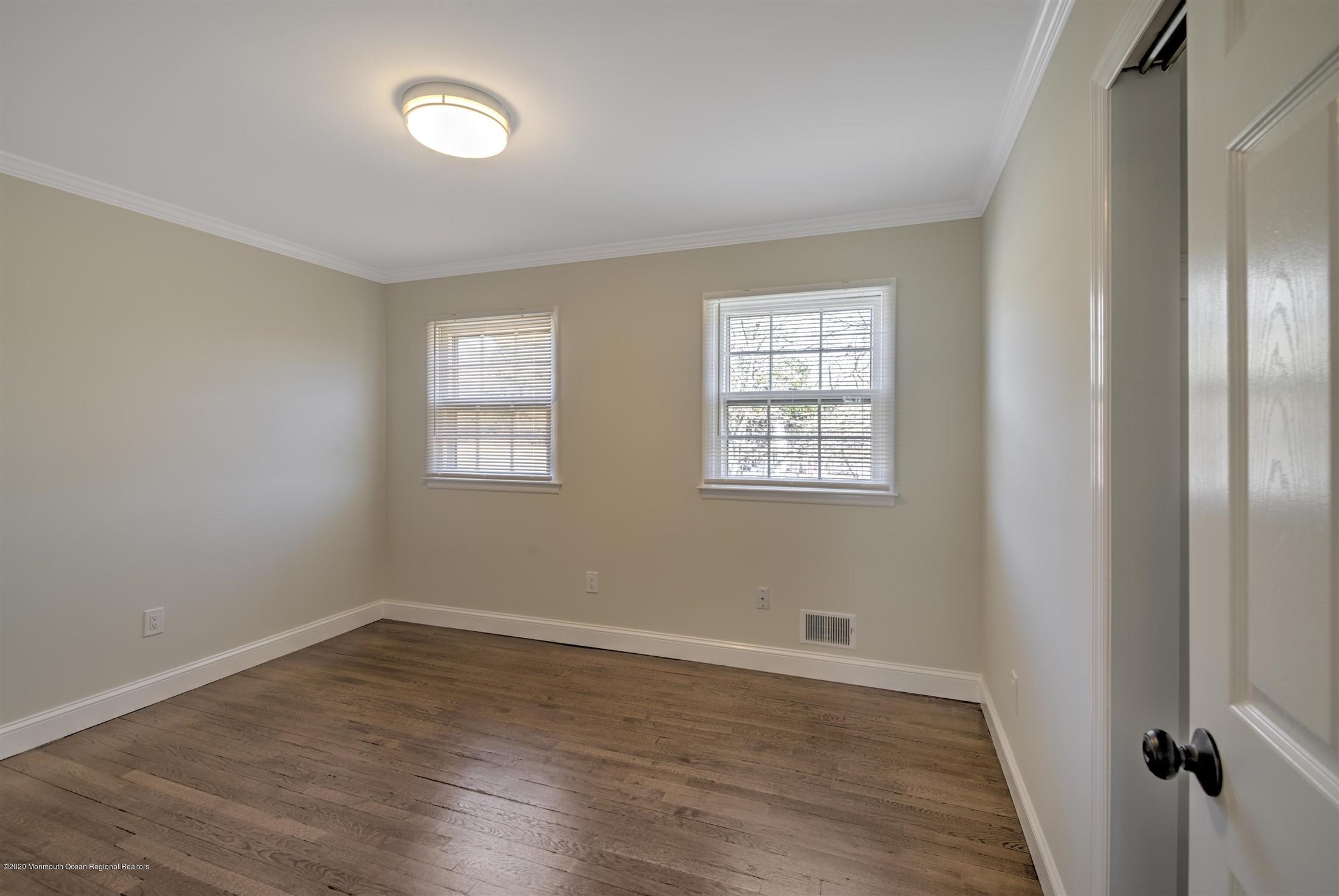 518 East Freehold Road Freehold, NJ 07728 - Photo 23 of 35 wooden floor in an empty room with a window