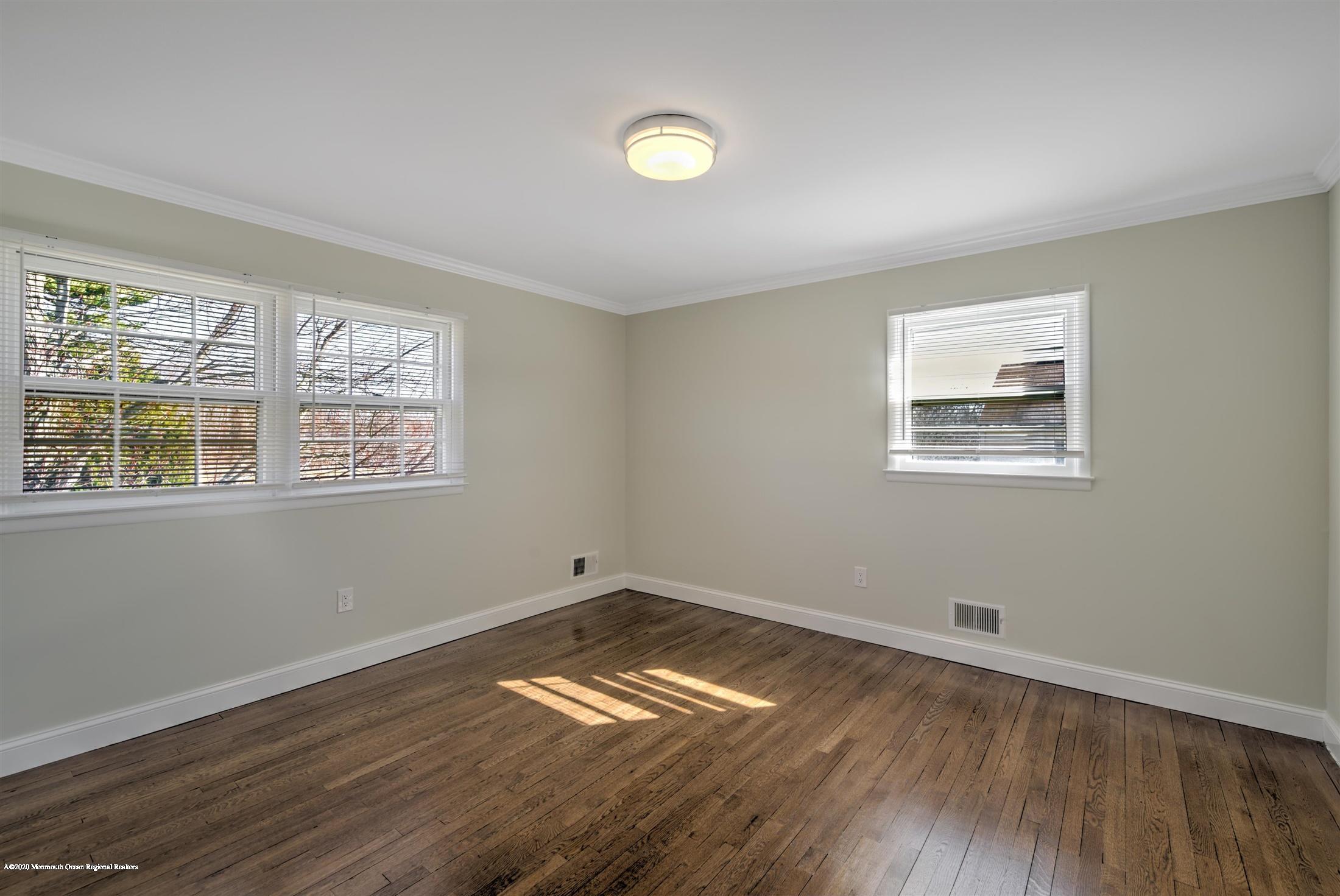 518 East Freehold Road Freehold, NJ 07728 - Photo 24 of 35 a view of empty room with wooden floor and fan