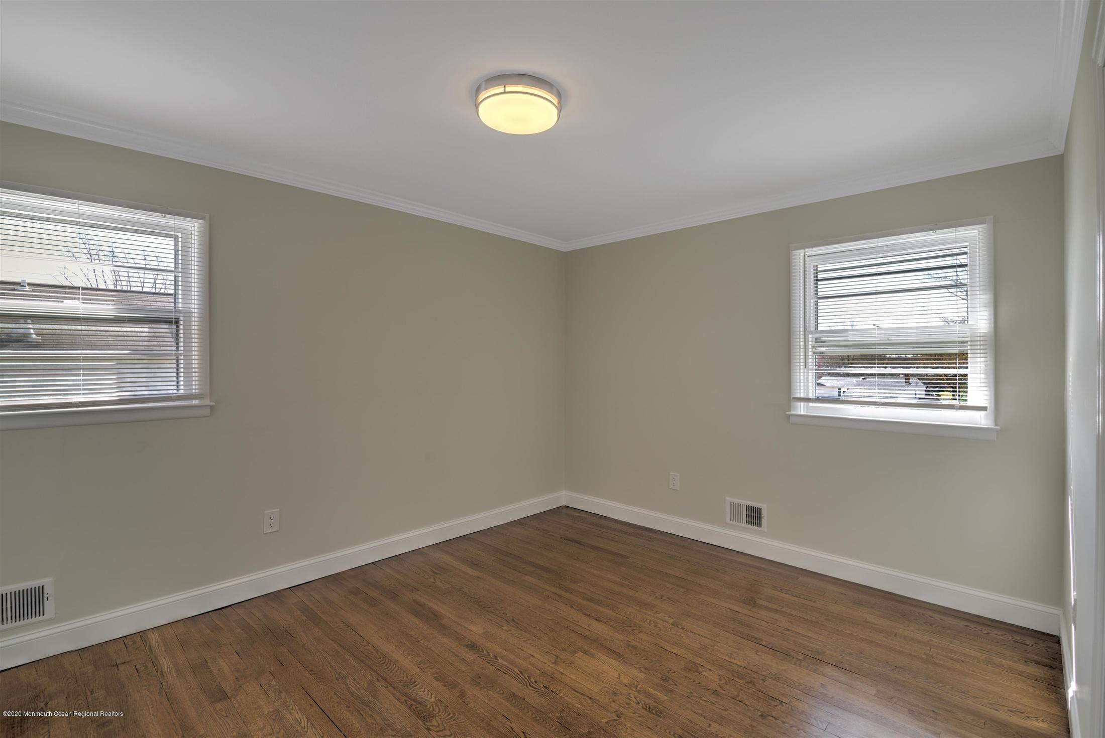 518 East Freehold Road Freehold, NJ 07728 - Photo 25 of 35 wooden floor in an empty room with a window