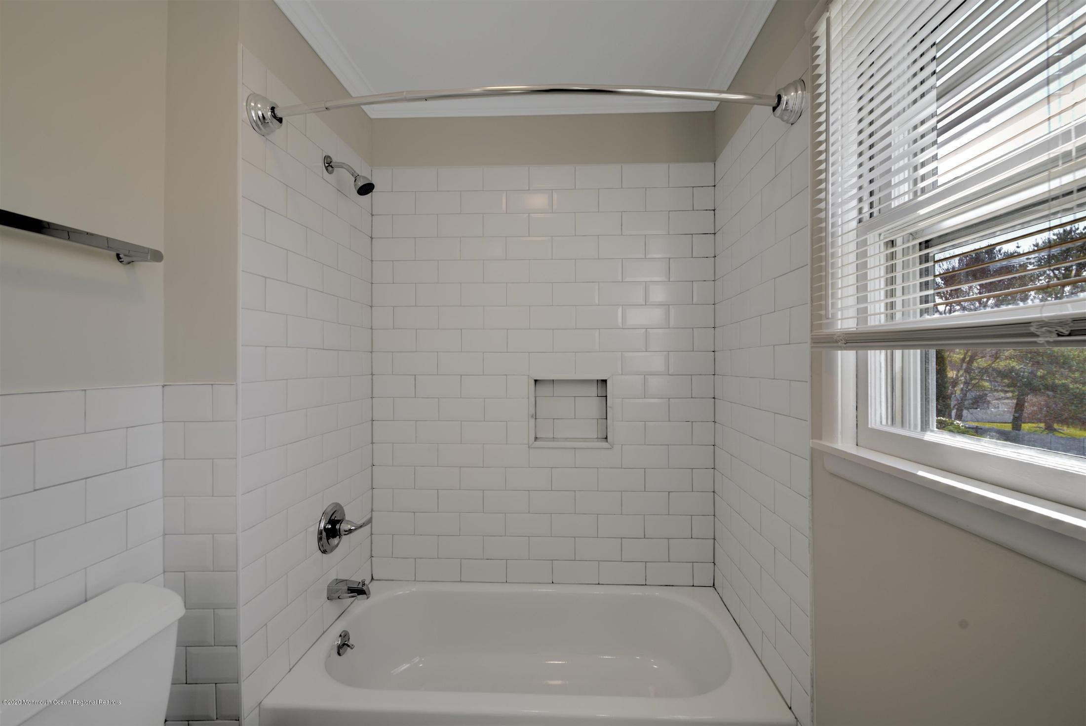 518 East Freehold Road Freehold, NJ 07728 - Photo 26 of 35 a bathroom with a shower and a bathtub