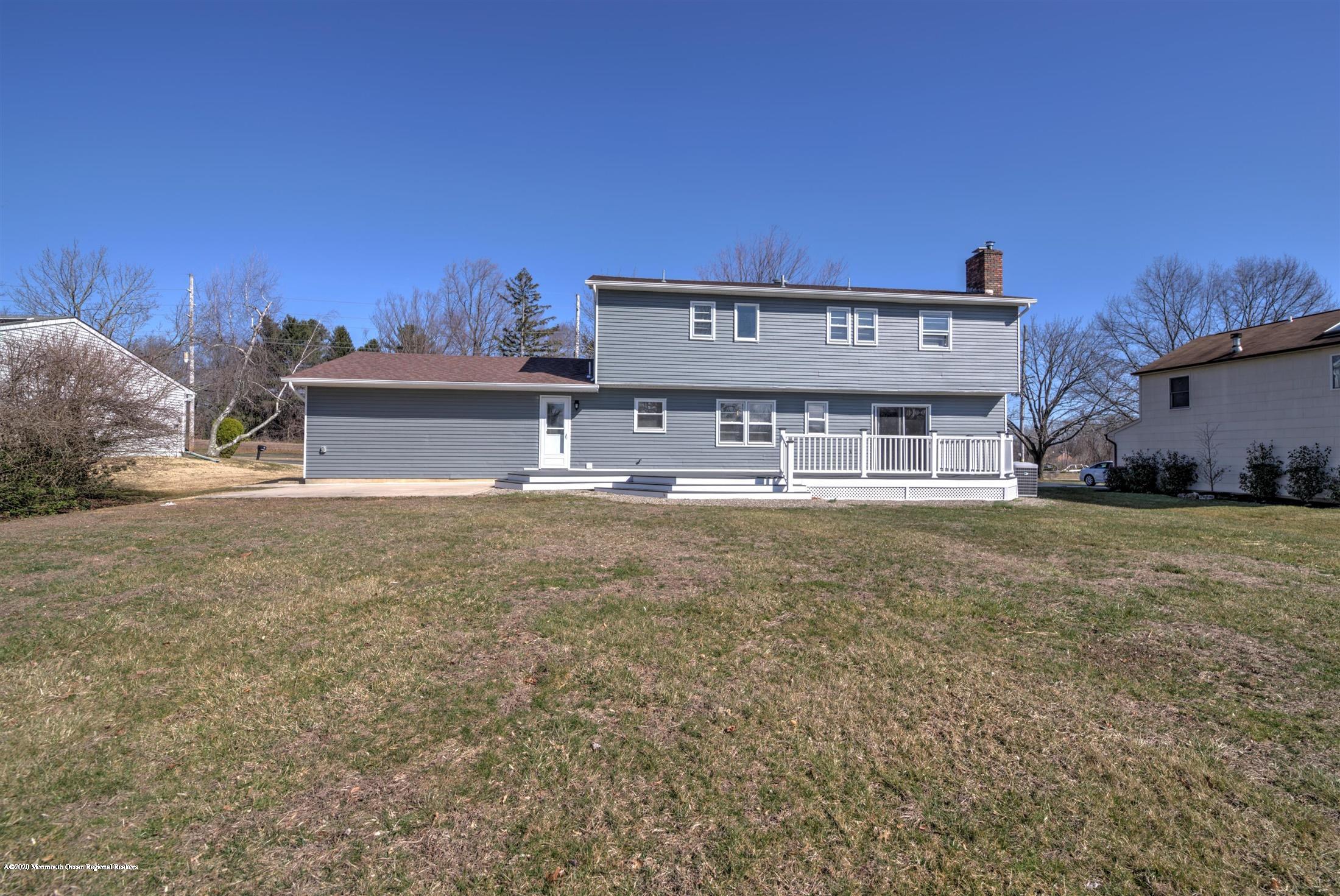 518 East Freehold Road Freehold, NJ 07728 - Photo 35 of 35 a front view of a house with a yard
